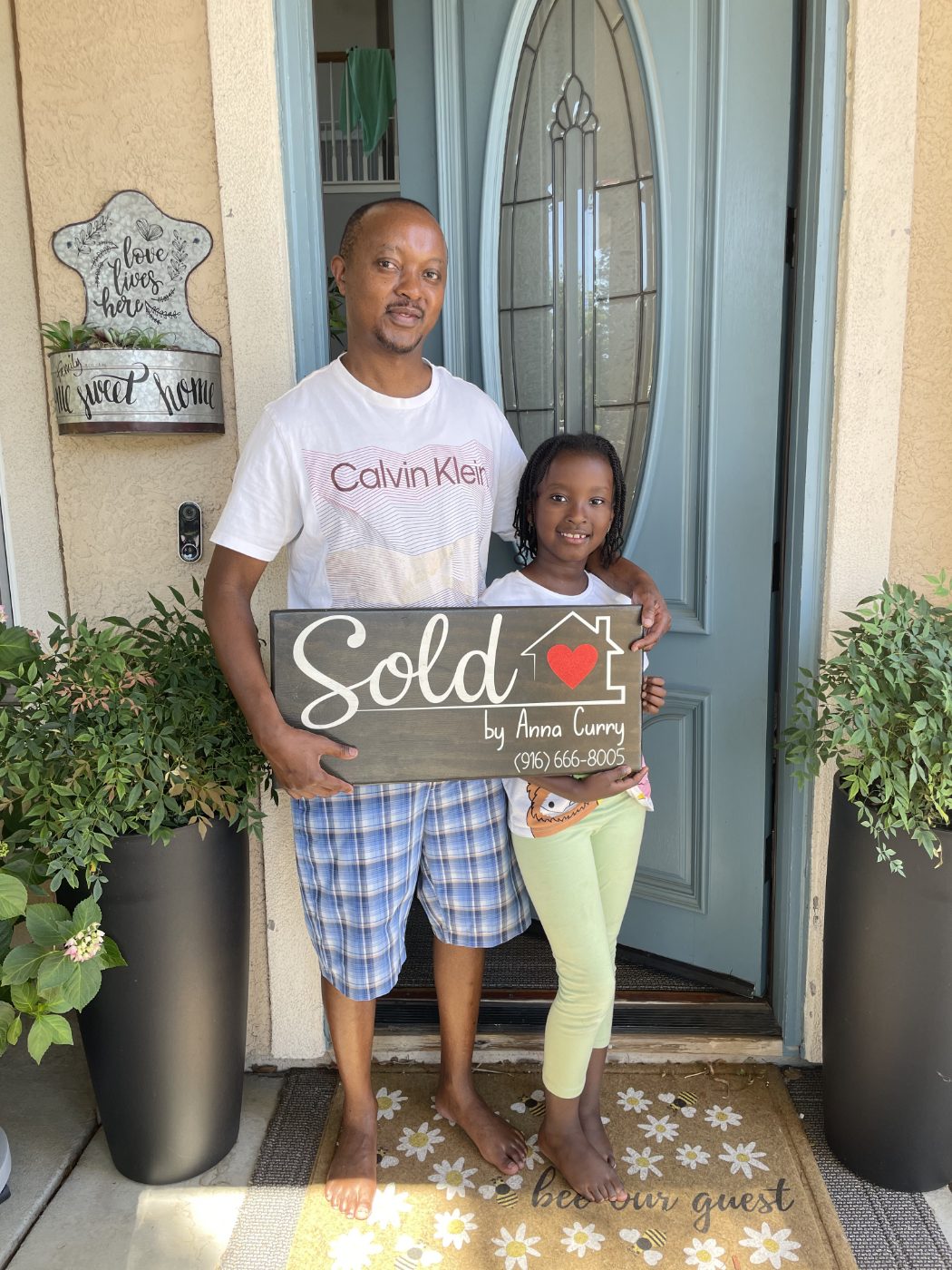 Happy client in front of their new duplex in Rancho Cordova